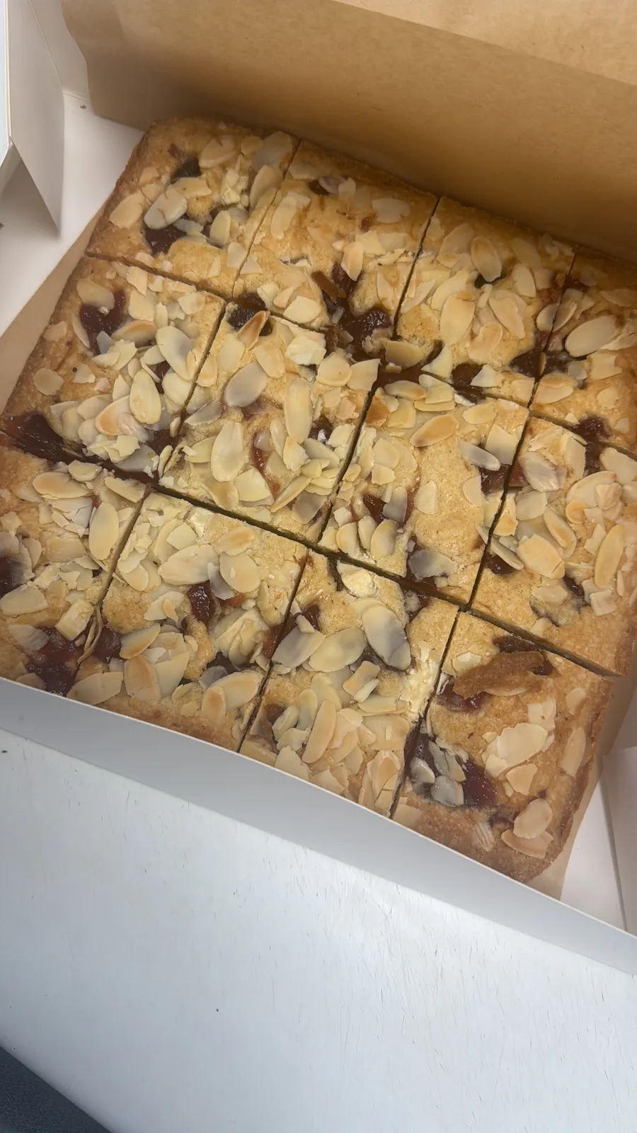 Almond Bakewell-style traybake cut into squares